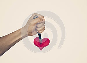 Stabbing a red heart