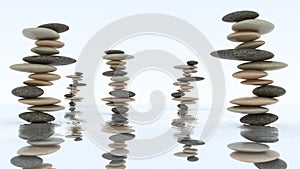 Stability and harmony. Pebble stacks on water