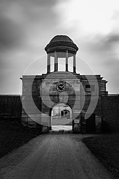 Stable entrance and clock tower in Black and white Attingham park shropshire