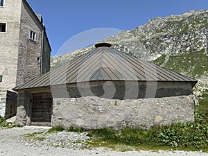 Stable with an octagonal base from 1776 Stalla a base ottagonale del 1776 in the Swiss Alps and in area of the mountain Gotthard photo