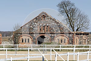 Stabling. Stone masonry with red-brick plastered decoration