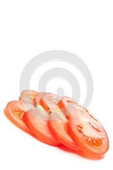 A stack of 4 slices of fresh tomat