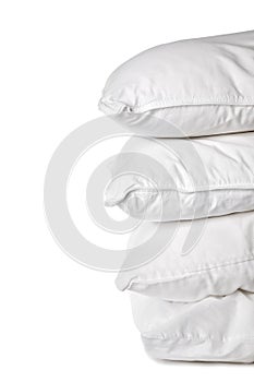 A stack of 4 white pillowcases