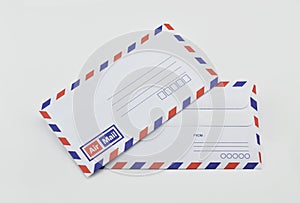 Stack of air mail envelopes on white
