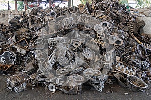 Stack of aluminium alloy cylinder head for recycling. Scrap engines parts