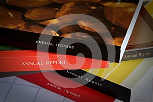 Stack Of Annual Reports Placed On Desk Calendar