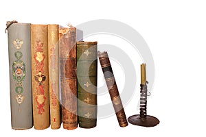 Stack antique books and candlestick