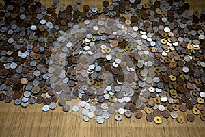 Stack of asian money coints on bamboo mat