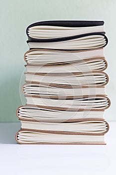 A stack of assorted paperback books