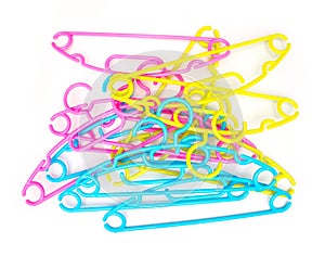 Stack of Baby clothes hangers on white background