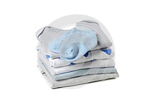 Stack of baby clothes isolated on background