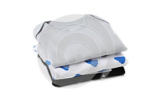 Stack of baby clothes isolated on background