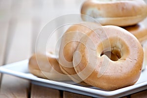 stack of bagel on white plate