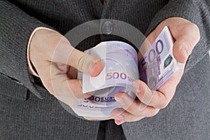 Stack banknotes euro in his hand