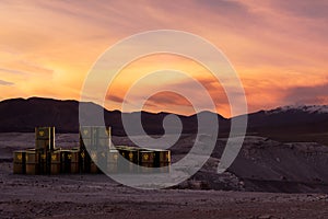 A stack of barrels with radioactive material abandoned in the desert