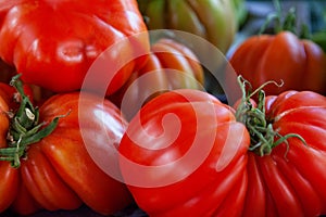 Stack of Beefsteak tomatoes on a market stall