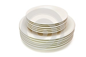 Stack of beige plates and saucers