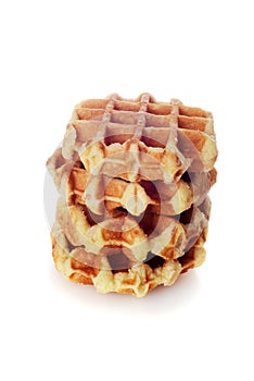 Stack of belgian waffles on white