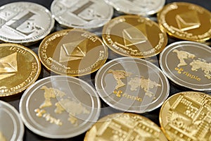 Stack of bitcoin, ripple, etherum and litecoin coins. Virtual currency concept.