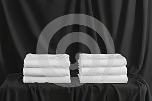 Stack of black and white folded clothes on dark background. mockup