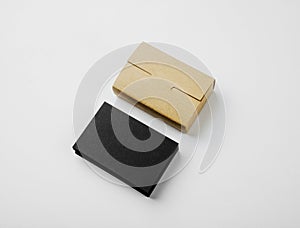 Stack of blank black business cards and craft Cards box on white background