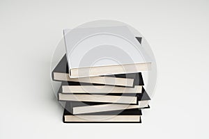 Stack of blank books on a white background
