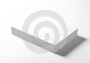 Stack of blank paper sheets isolated on white background