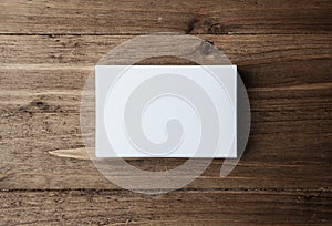 Stack of blank white business cards on wooden background Horizontal