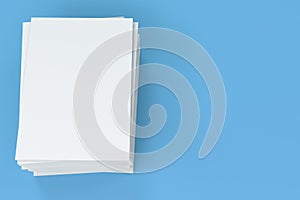Stack of blank white closed brochure mock-up on blue background
