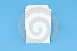 Stack of blank white closed brochure mock-up on blue background