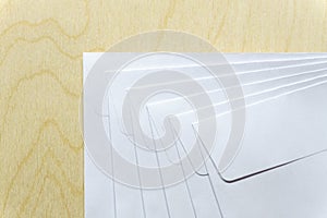 Blank white envelopes on wooden desk
