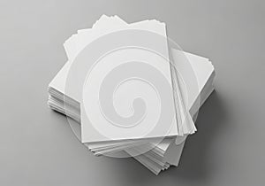 Stack of blank white paper sheets on a gray background