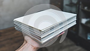 Stack of Blank White Paper Sheets Held
