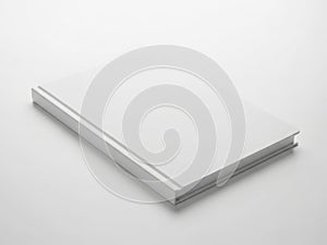 A stack of blank white paper sheets on a white surface