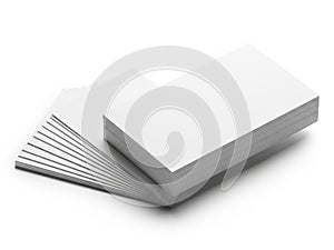 A stack of blank white paper sheets on top of a gray textured surface