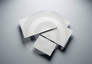 Stack of blank white rectangular and square cards on gray background blank cards