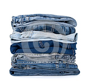 Stack of blue denim clothes photo