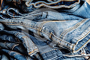 Stack of blue jeans closeup