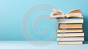 Stack of books against blue background