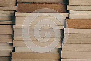 Stack of books background. Row of books as background for design. Education and wisdom concept. Old vintage books background.