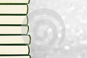 Stack of books with bokeh background for copy space area