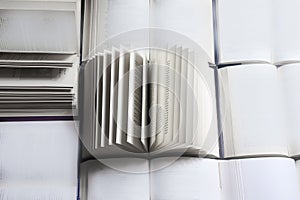 stack of books, close up. Open book on the table in library. Back to school concept.