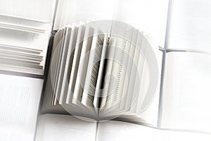 stack of books, close up. Open book on the table in library. Back to school concept.