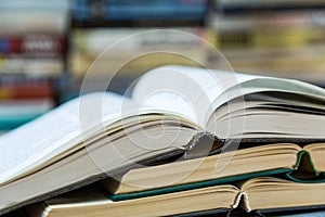 A stack of books with colorful covers. The library or bookstore. Books or textbooks. Education and reading