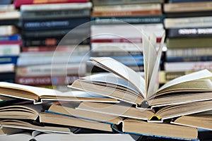 A stack of books with colorful covers. The library or bookstore. Books or textbooks. Education and reading