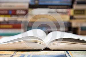 A stack of books with colorful covers. The library or bookstore. Books or textbooks. Education and reading