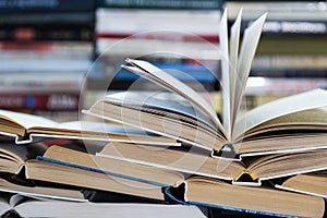 A stack of books with colorful covers. The library or bookstore. Books or textbooks. Education and reading photo