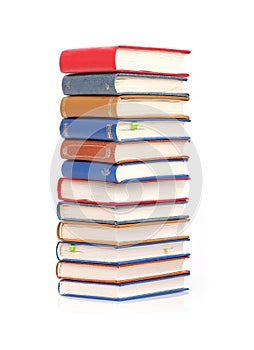 Stack of books in colour covers with white sheets