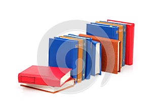 Stack of books in colour covers with white sheets