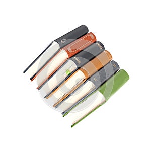 Stack of books in colour covers with white sheets